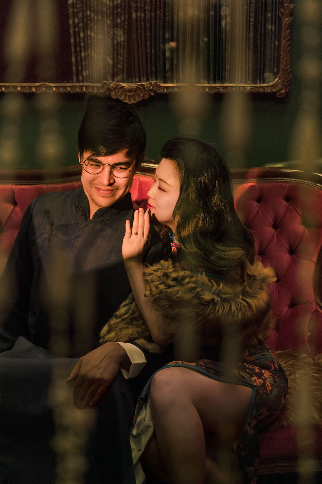 Claire and Michael on a red sofa, Shanghai evening
